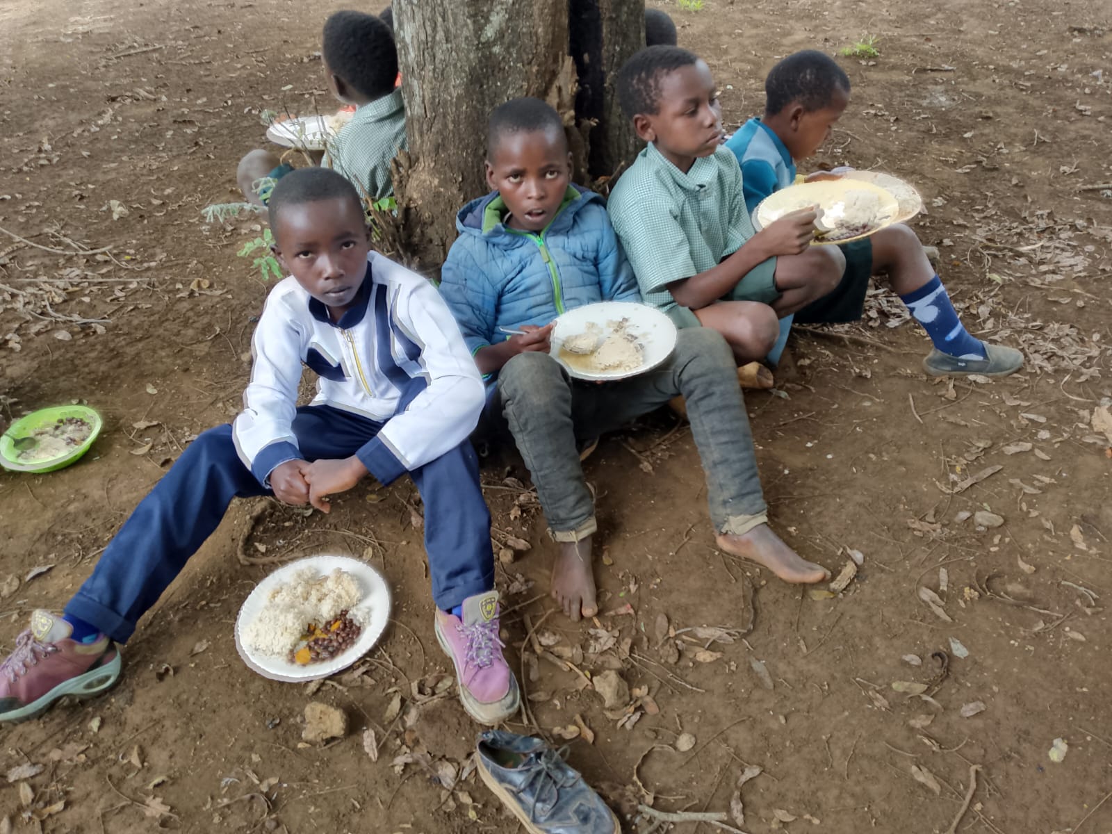 Children sharing a meal during outreach