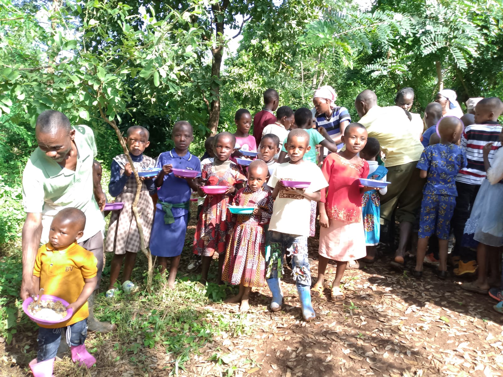 Children receiving a hot meal during a feeding program
